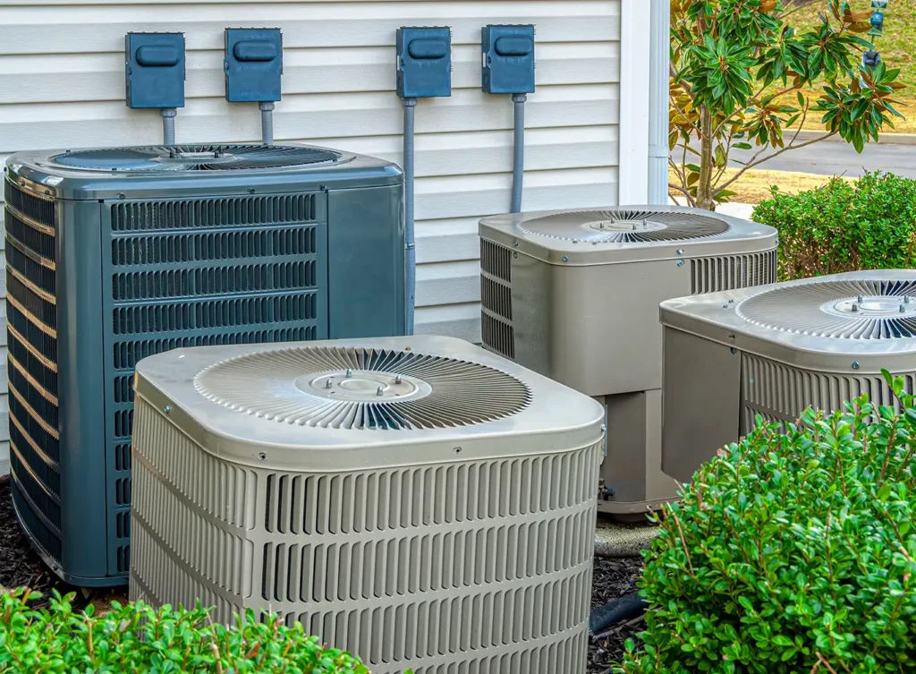 a couple of different hvac systems outside a residential living complex springfield il