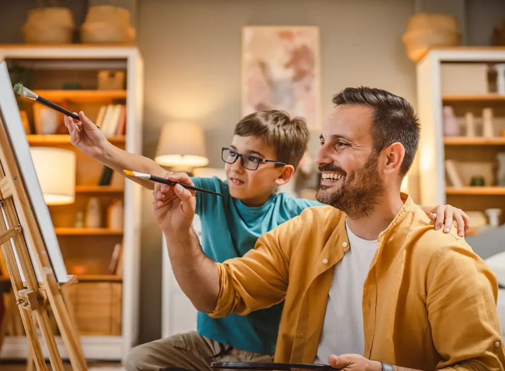 Springfield IL father and son painting showcasing peace of mind, knowing their hvac system is working properly after having a routine inspection